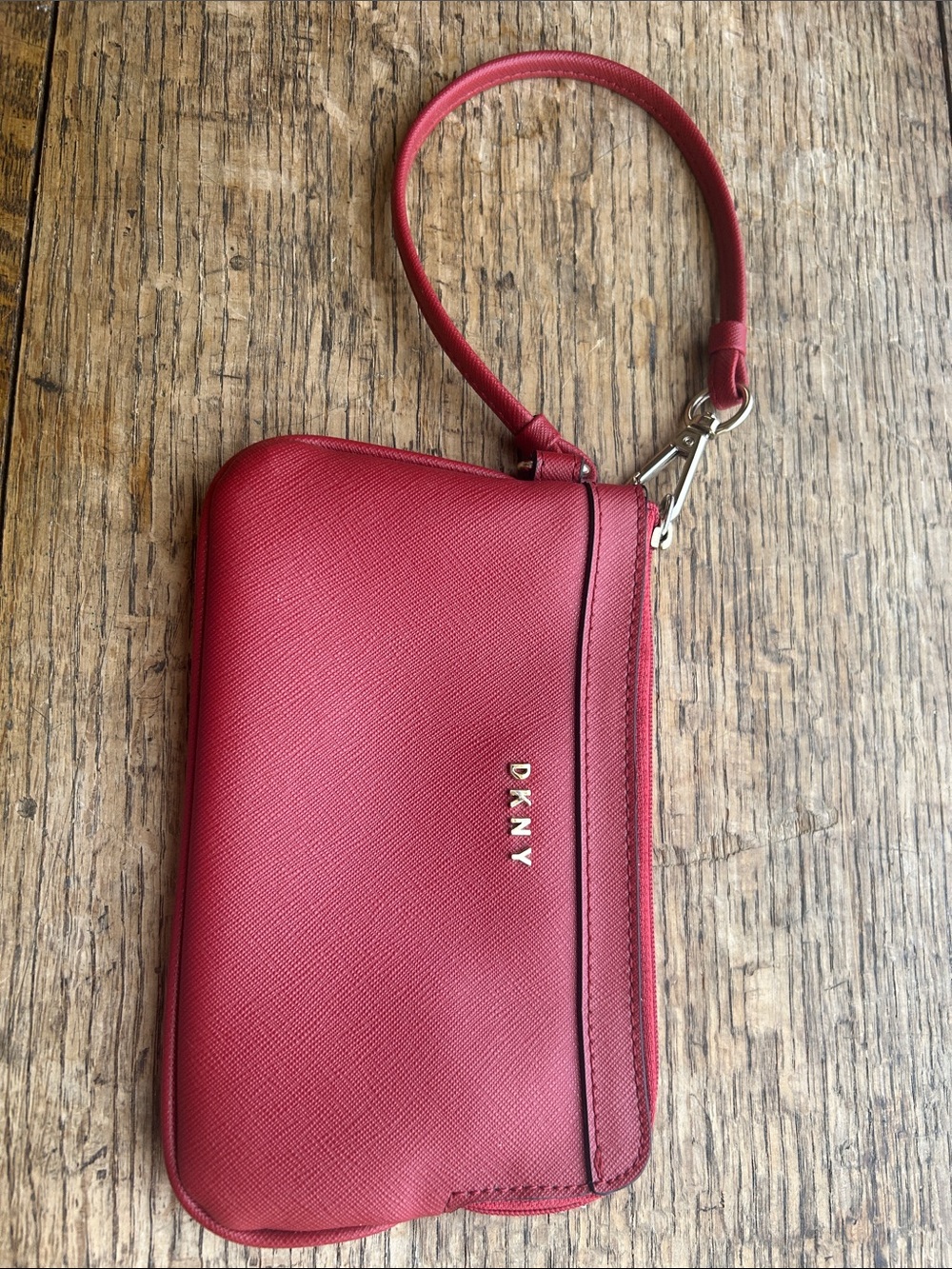 DKNY Bryan Red Saffiano Wristlet Clutch With Strap. Classic Textured Leather.